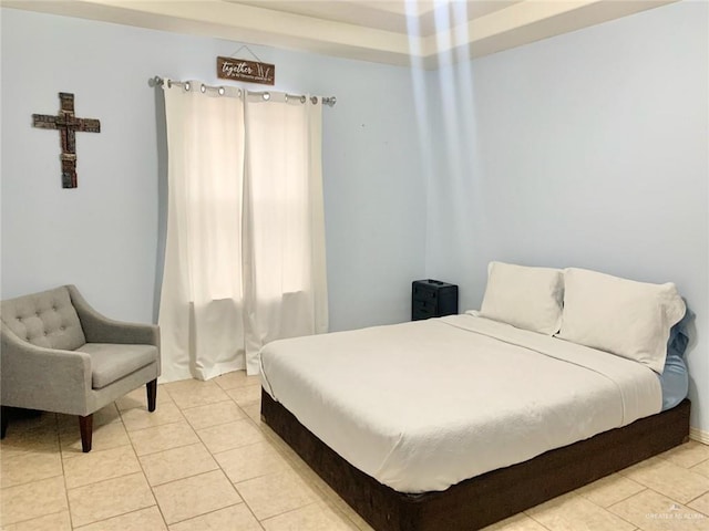 bedroom with light tile patterned flooring