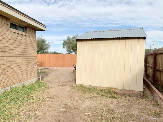 view of property exterior with a storage shed