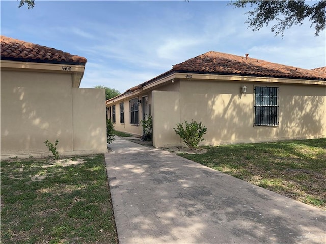 view of home's exterior with a yard