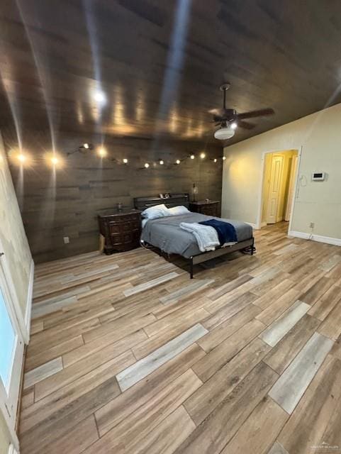 unfurnished bedroom featuring ceiling fan and light wood-type flooring