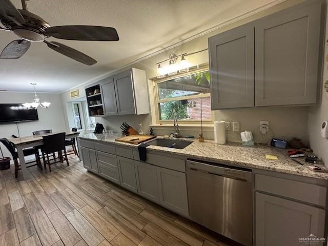 kitchen featuring gray cabinetry, ceiling fan with notable chandelier, sink, crown molding, and stainless steel dishwasher