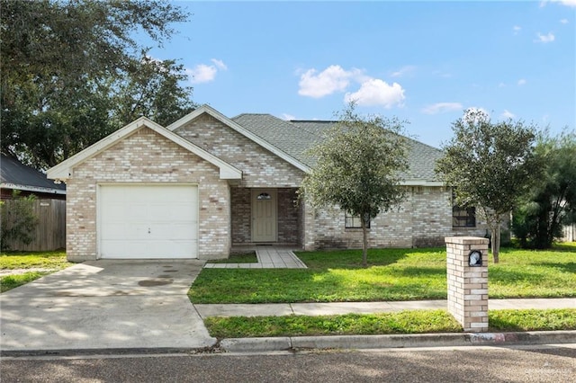 view of front facade with driveway, an attached garage, a front yard, brick siding, and roof with shingles