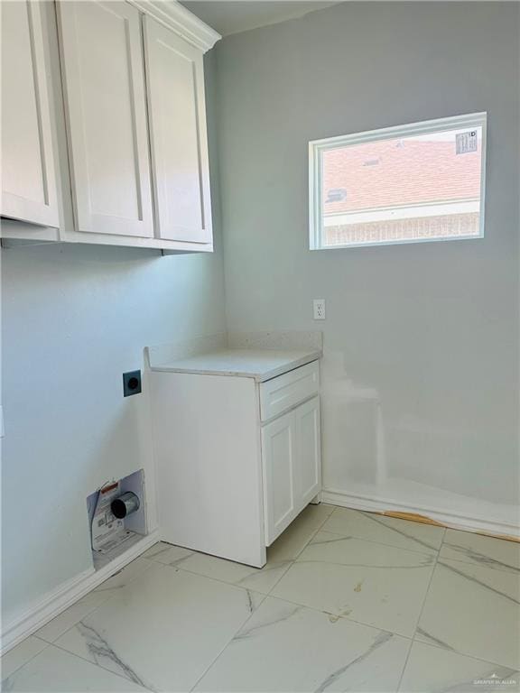 laundry area with marble finish floor, cabinet space, and hookup for an electric dryer