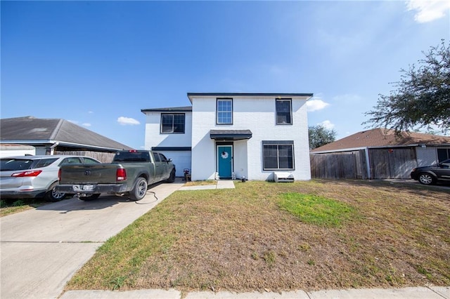 view of front property with a front lawn and a garage