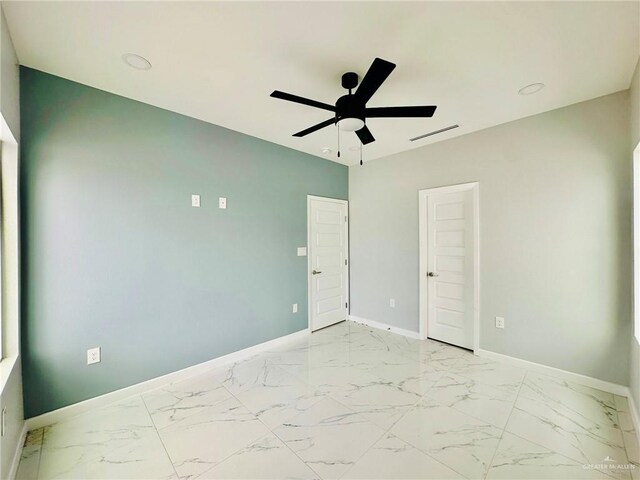 spare room featuring ceiling fan