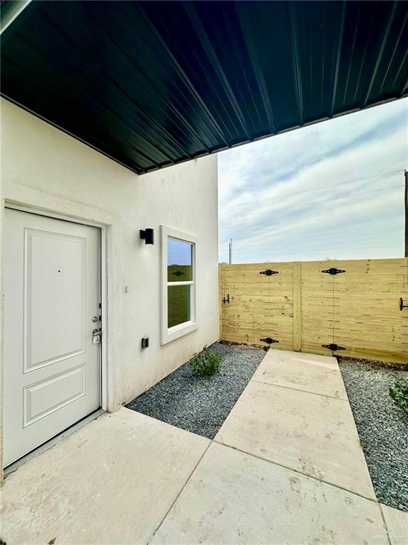 entrance to property with a patio