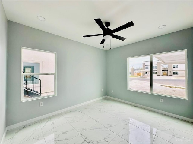 spare room featuring ceiling fan