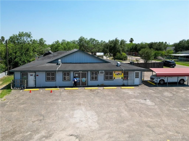 view of front of property with a carport