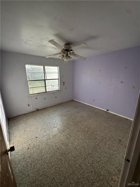 unfurnished room with ceiling fan