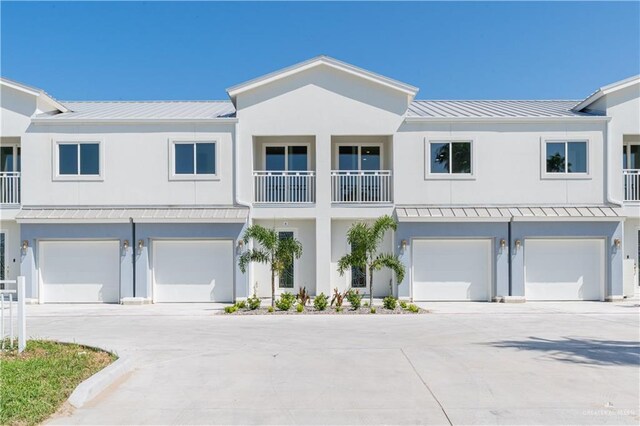 109 E Parade Dr Unit G, South Padre Island, TX 78597 - view of property featuring a garage and a balcony