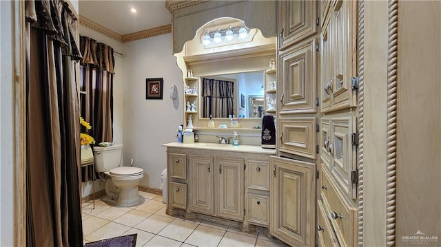 bathroom featuring tile patterned floors, vanity, toilet, and crown molding