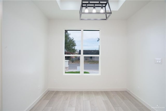 spare room with light wood-type flooring