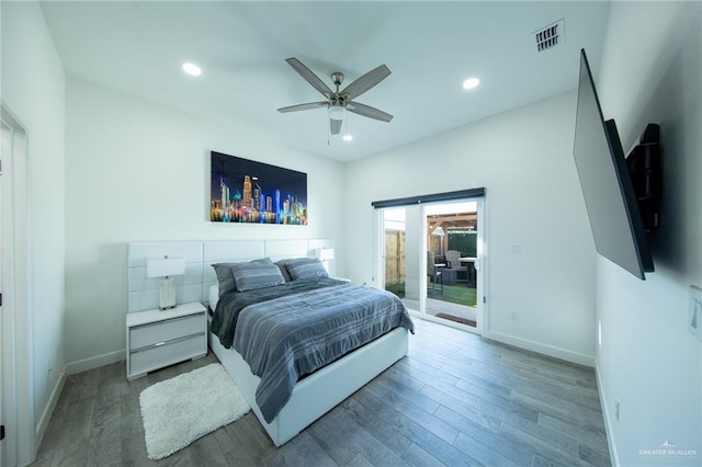 bedroom with access to exterior, recessed lighting, wood finished floors, and visible vents