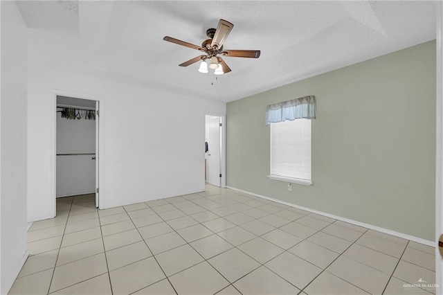 517 Gemini St, Mission, TX 78572 - unfurnished bedroom with a ceiling fan, a closet, baseboards, and a spacious closet