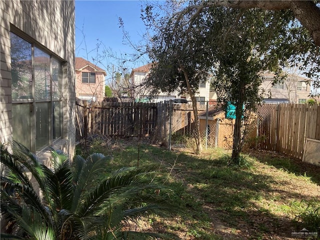 view of yard with a fenced backyard