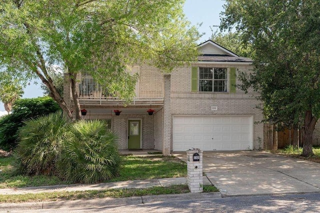 3301 Princeton Ave, Mcallen, TX 78504 - view of front of home featuring brick siding, an attached garage, concrete driveway, and a balcony
