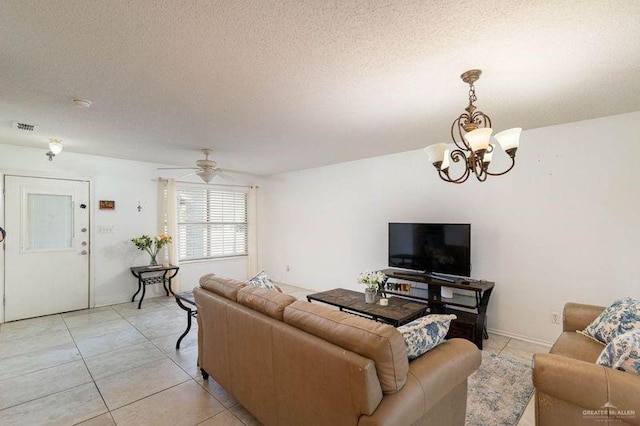 3301 Princeton Ave, Mcallen, TX 78504 - living room with light tile patterned floors, a chandelier, ceiling fan, and a textured ceiling