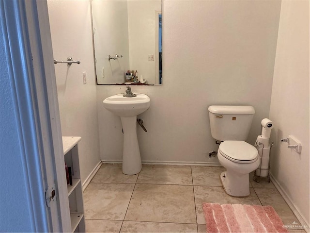 bathroom featuring tile patterned floors and toilet