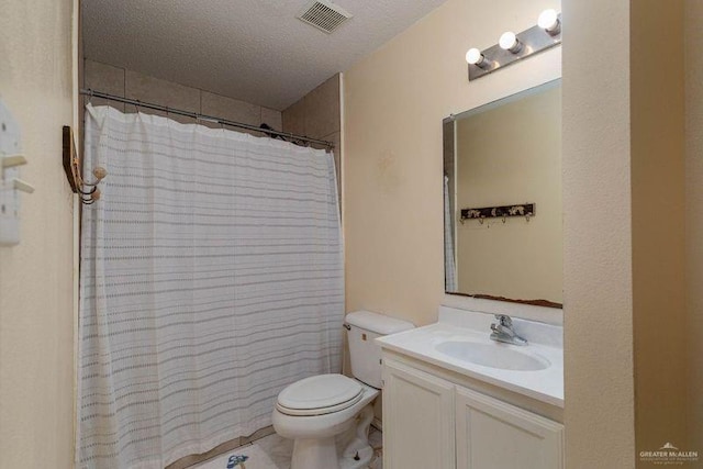3301 Princeton Ave, Mcallen, TX 78504 - bathroom with toilet, vanity, a shower with curtain, and a textured ceiling