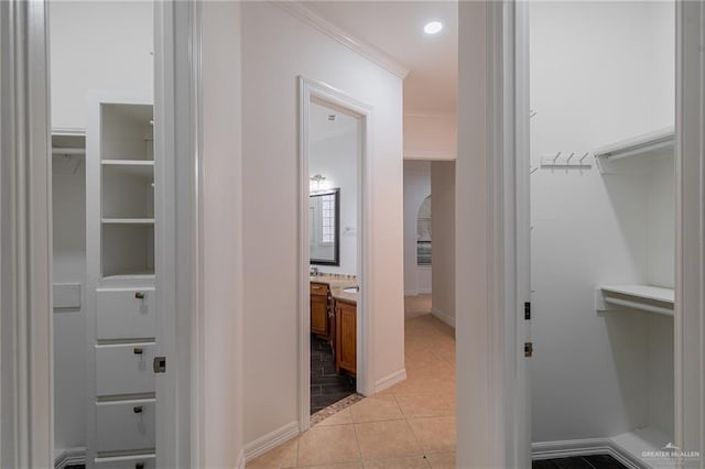 3909 S M St, Mcallen, TX 78503 - hallway featuring ornamental molding, light tile patterned floors, and baseboards