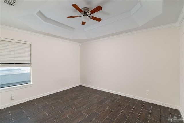 3909 S M St, Mcallen, TX 78503 - unfurnished room featuring a tray ceiling, a ceiling fan, wood tiled floors, and baseboards