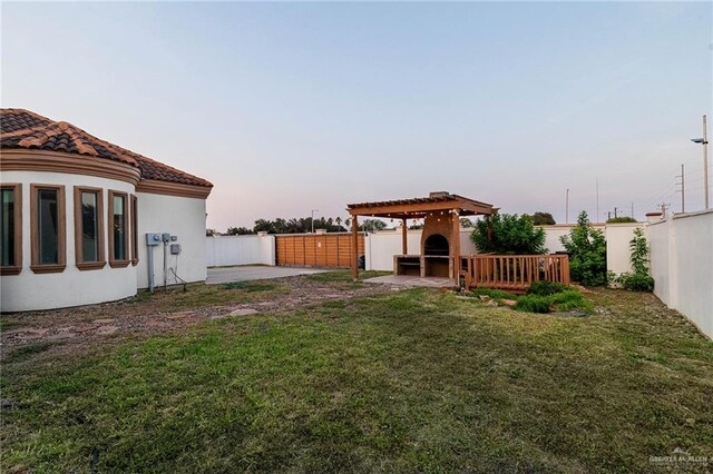 3909 S M St, Mcallen, TX 78503 - yard at dusk with a pergola and a patio area