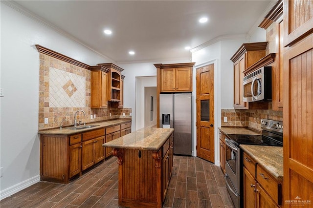 3909 S M St, Mcallen, TX 78503 - kitchen with stainless steel appliances, wood finish floors, open shelves, brown cabinetry, and crown molding