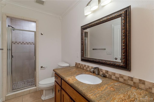 3909 S M St, Mcallen, TX 78503 - bathroom with toilet, vanity, a shower stall, crown molding, and tile patterned floors