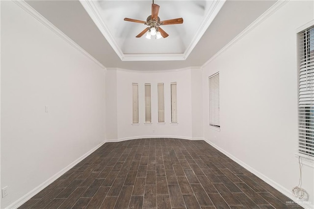 3909 S M St, Mcallen, TX 78503 - spare room with ceiling fan, a raised ceiling, baseboards, crown molding, and dark wood-style flooring