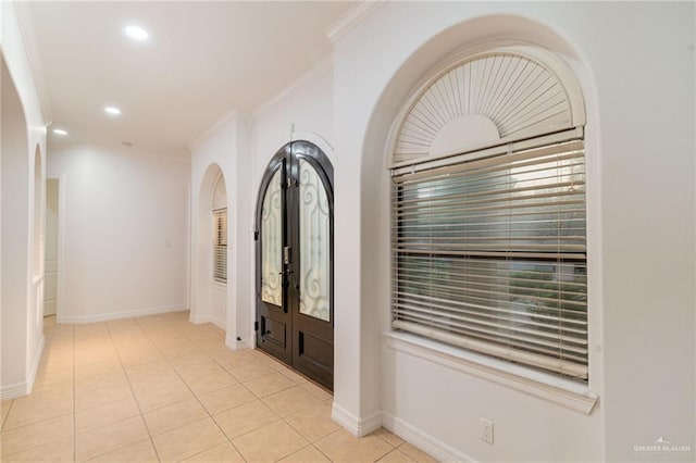 3909 S M St, Mcallen, TX 78503 - entrance foyer featuring french doors, crown molding, recessed lighting, light tile patterned flooring, and baseboards