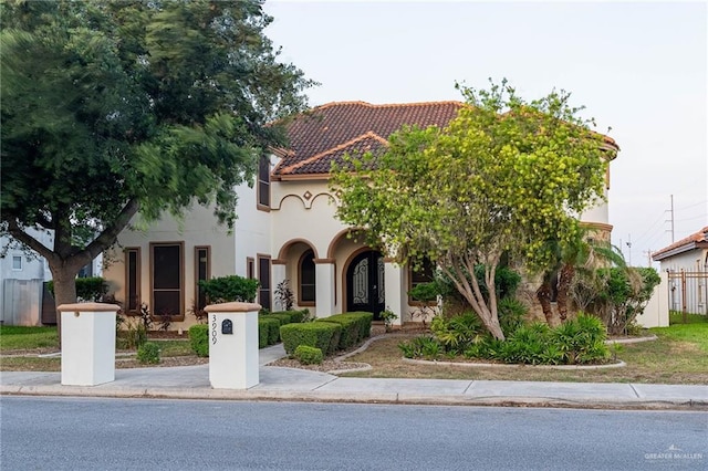 3909 S M St, Mcallen, TX 78503 - view of front of property with stucco siding and a tiled roof