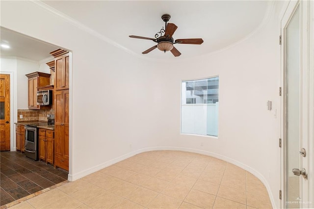 3909 S M St, Mcallen, TX 78503 - unfurnished room with crown molding, ceiling fan, tile patterned flooring, and baseboards