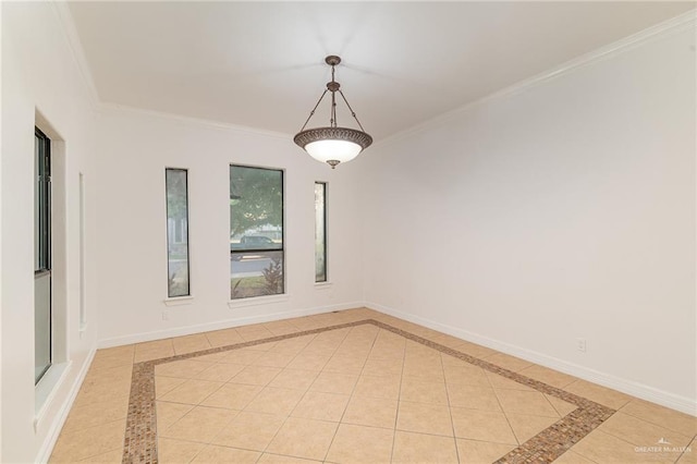 3909 S M St, Mcallen, TX 78503 - spare room featuring crown molding, inlaid floor details, baseboards, and light tile patterned floors