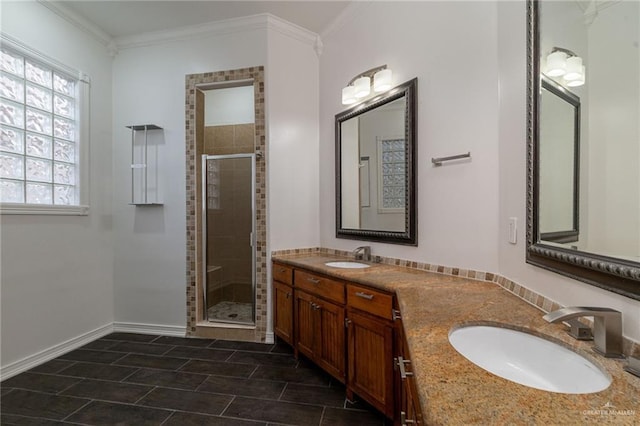 3909 S M St, Mcallen, TX 78503 - full bathroom with a shower stall, double vanity, baseboards, crown molding, and tile patterned flooring