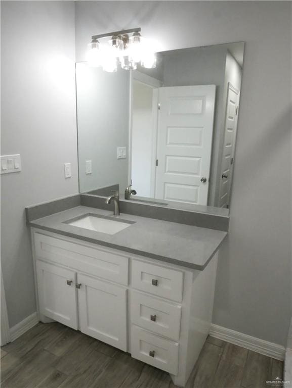 12517 Mile 2 W, Weslaco, TX 78599 - bathroom featuring wood finished floors and vanity