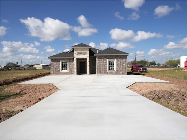 12517 Mile 2 W, Weslaco, TX 78599 - prairie-style house with brick siding and driveway