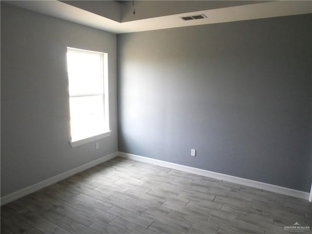 12517 Mile 2 W, Weslaco, TX 78599 - empty room with wood finished floors and baseboards