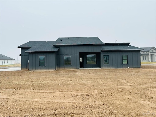 rear view of house with a lawn