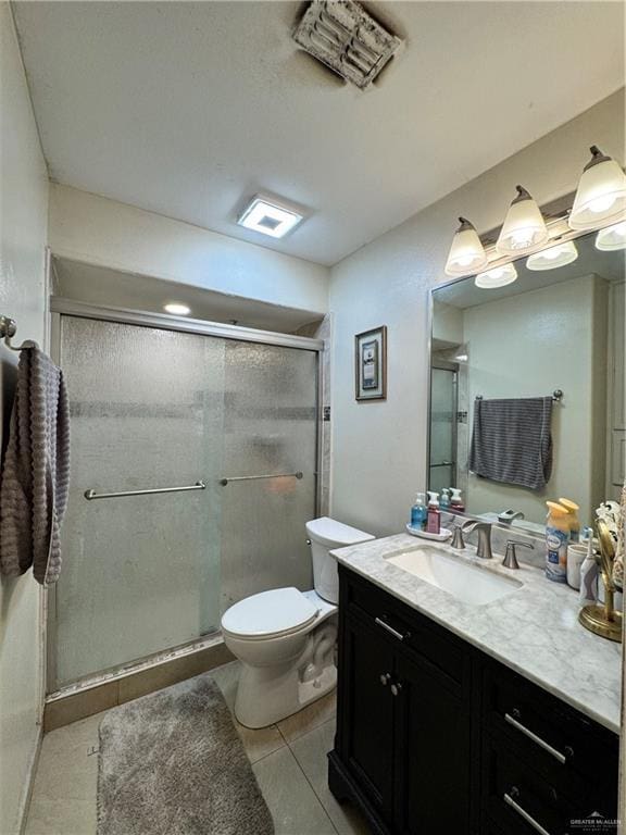 704 S 17th St, Hidalgo, TX 78557 - full bath with vanity, a stall shower, and tile patterned floors