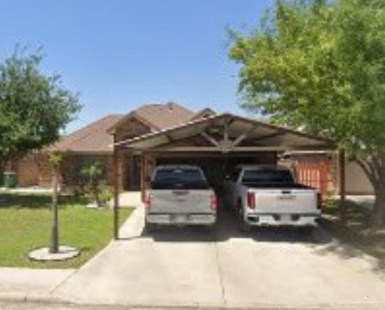 704 S 17th St, Hidalgo, TX 78557 - view of car parking with a carport and driveway