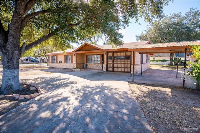 ranch-style home with a carport