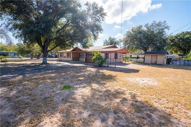 view of front of house with a shed