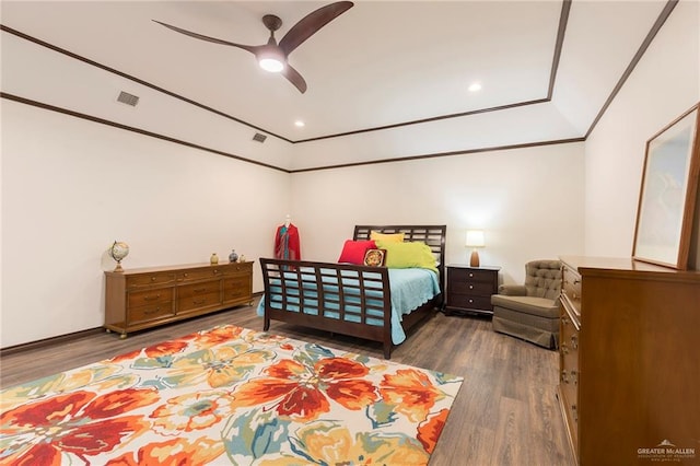 bedroom with dark hardwood / wood-style floors and ceiling fan