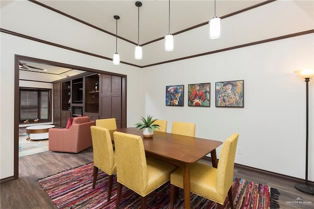 dining space with dark hardwood / wood-style flooring