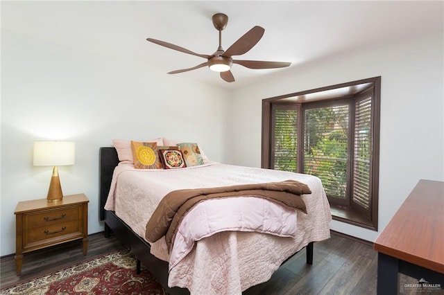 bedroom featuring ceiling fan and dark wood-type flooring