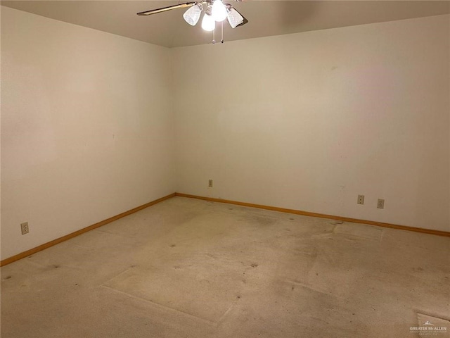 empty room with ceiling fan and carpet