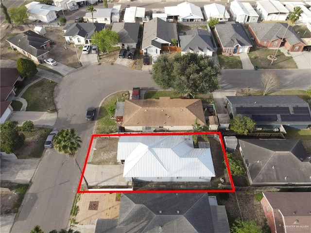 birds eye view of property with a residential view