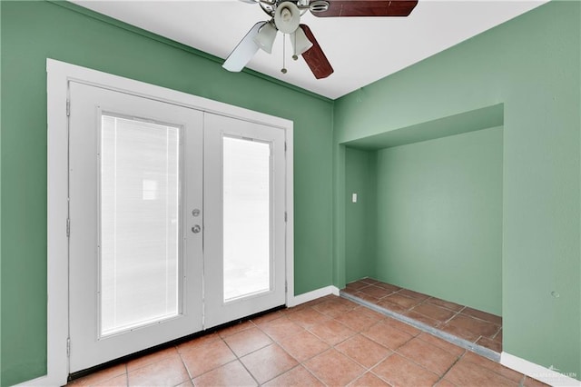 doorway with light tile patterned floors, ceiling fan, and french doors