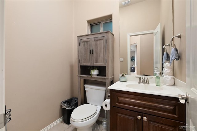 bathroom with vanity, tile patterned floors, and toilet