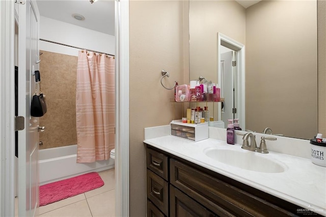 full bathroom featuring toilet, tile patterned floors, vanity, and shower / bathtub combination with curtain